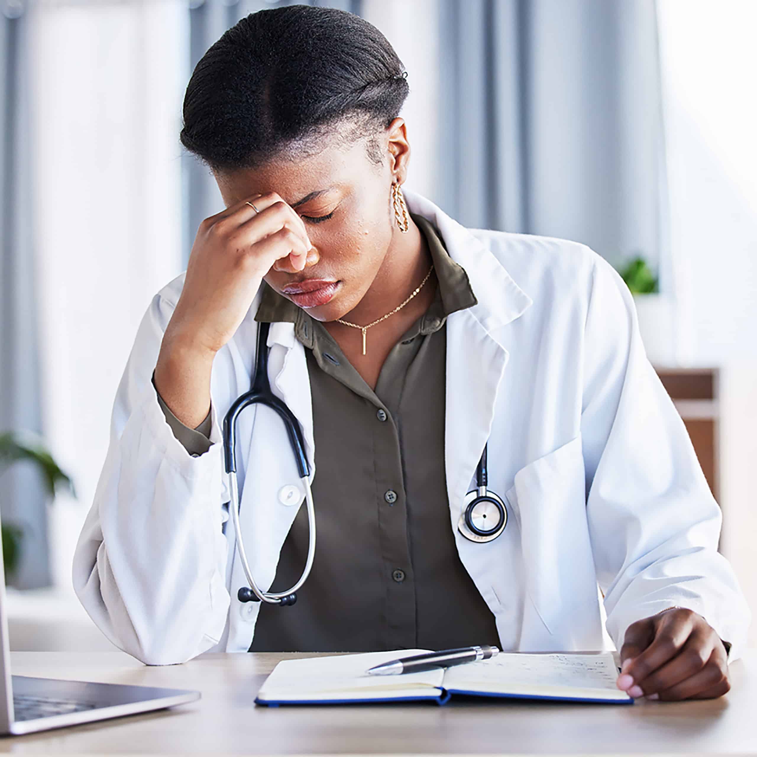 Headache, tired doctor and woman in medical office with burnout challenge, clinic problem and stress risk. Frustrated black female healthcare worker with fatigue, migraine pain and anxiety of mistake.